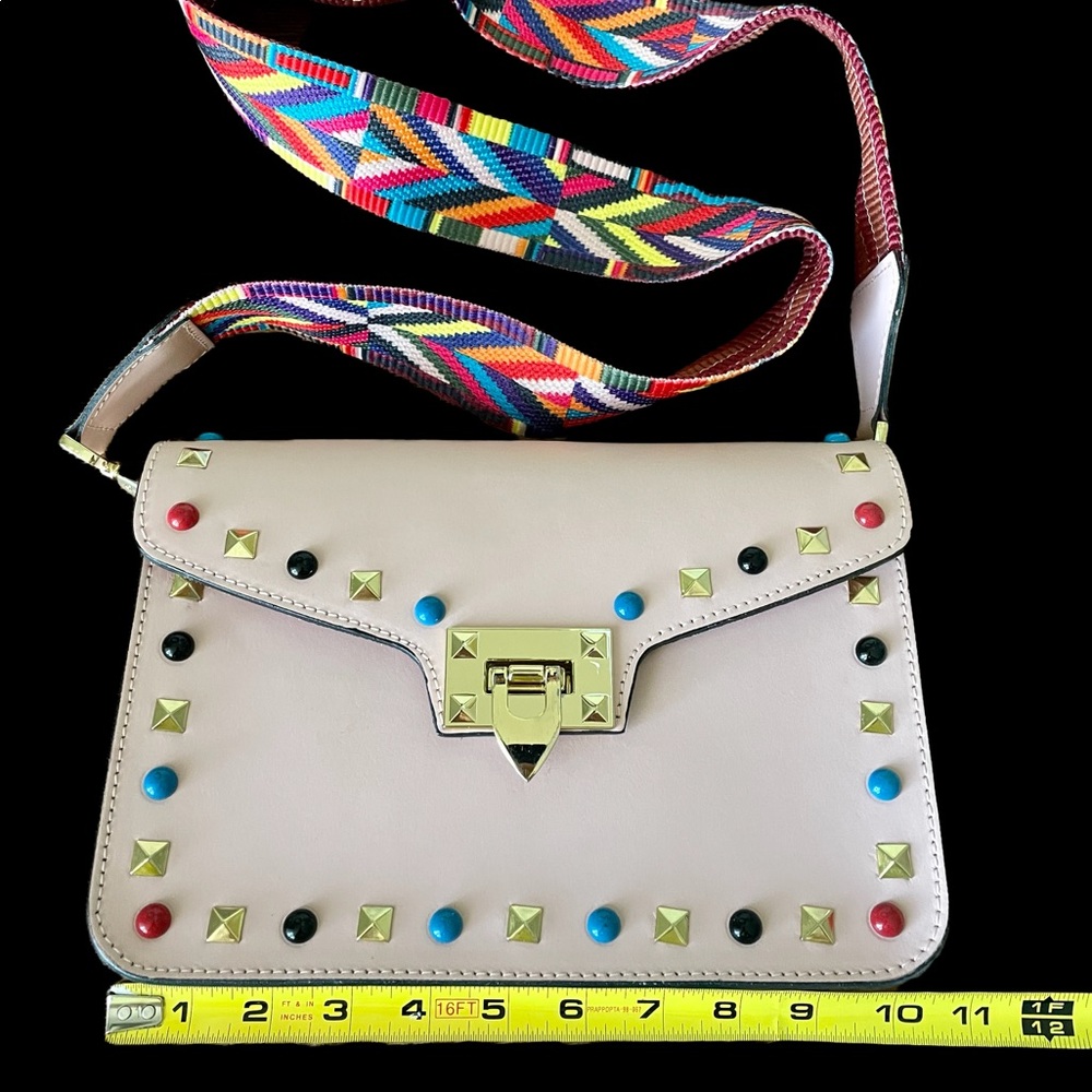 Pink Purse with color studs.  Leather. Unlined. Gold details. Like new.
